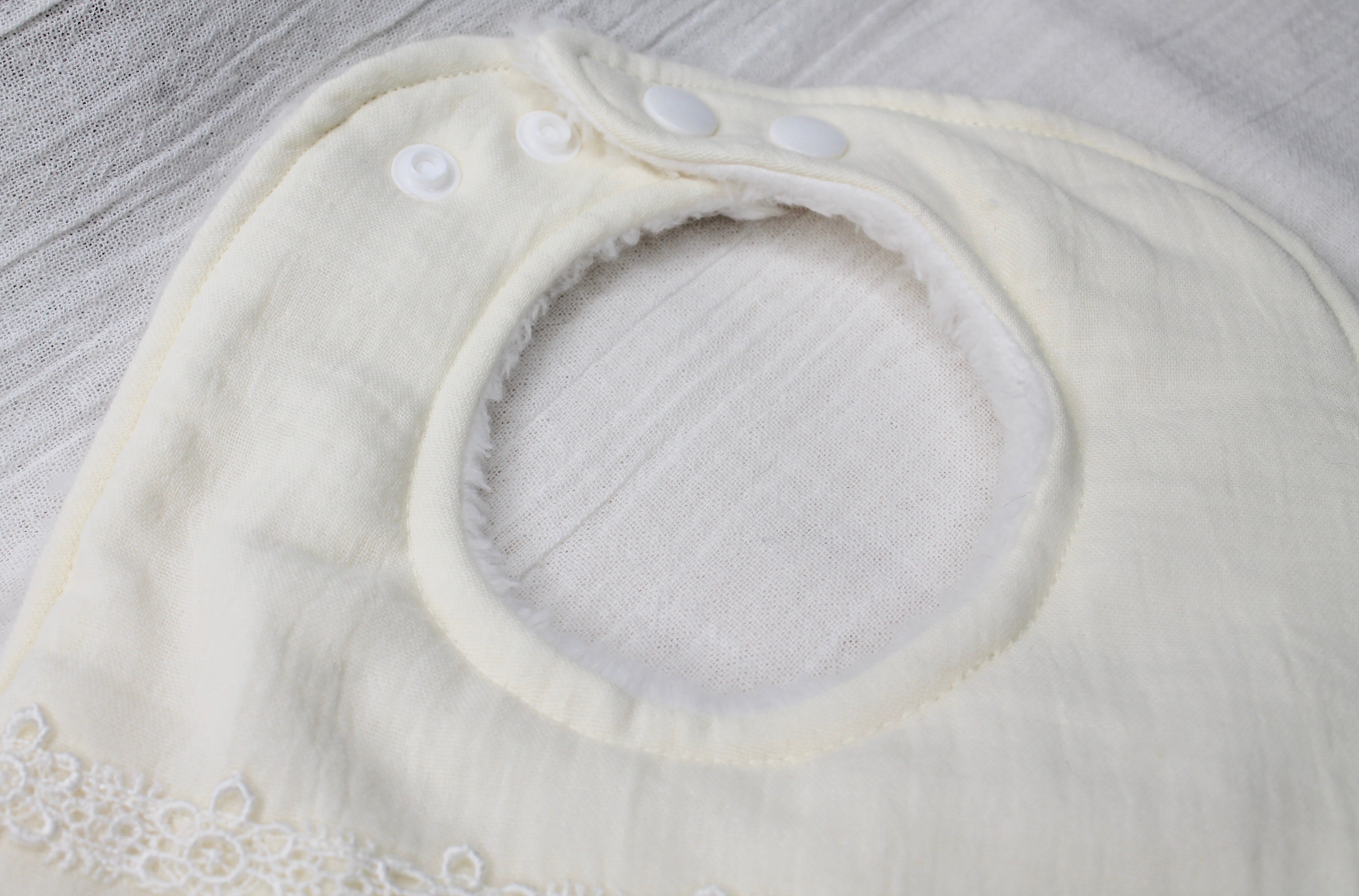 Cream Double Cloth Daisy Chain Lace Bib with Fleece Backing